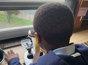Student with microscope