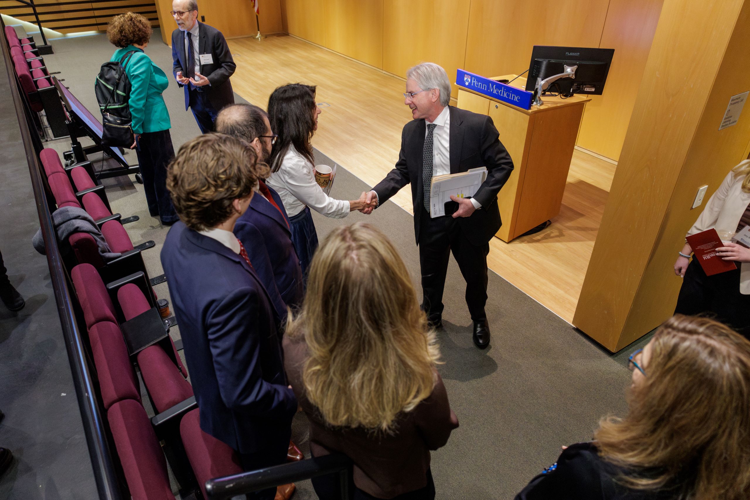 Dean Epstein greeting the Brinster Family at the 2026 Elaine Redding Brinster Prize Ceremony.