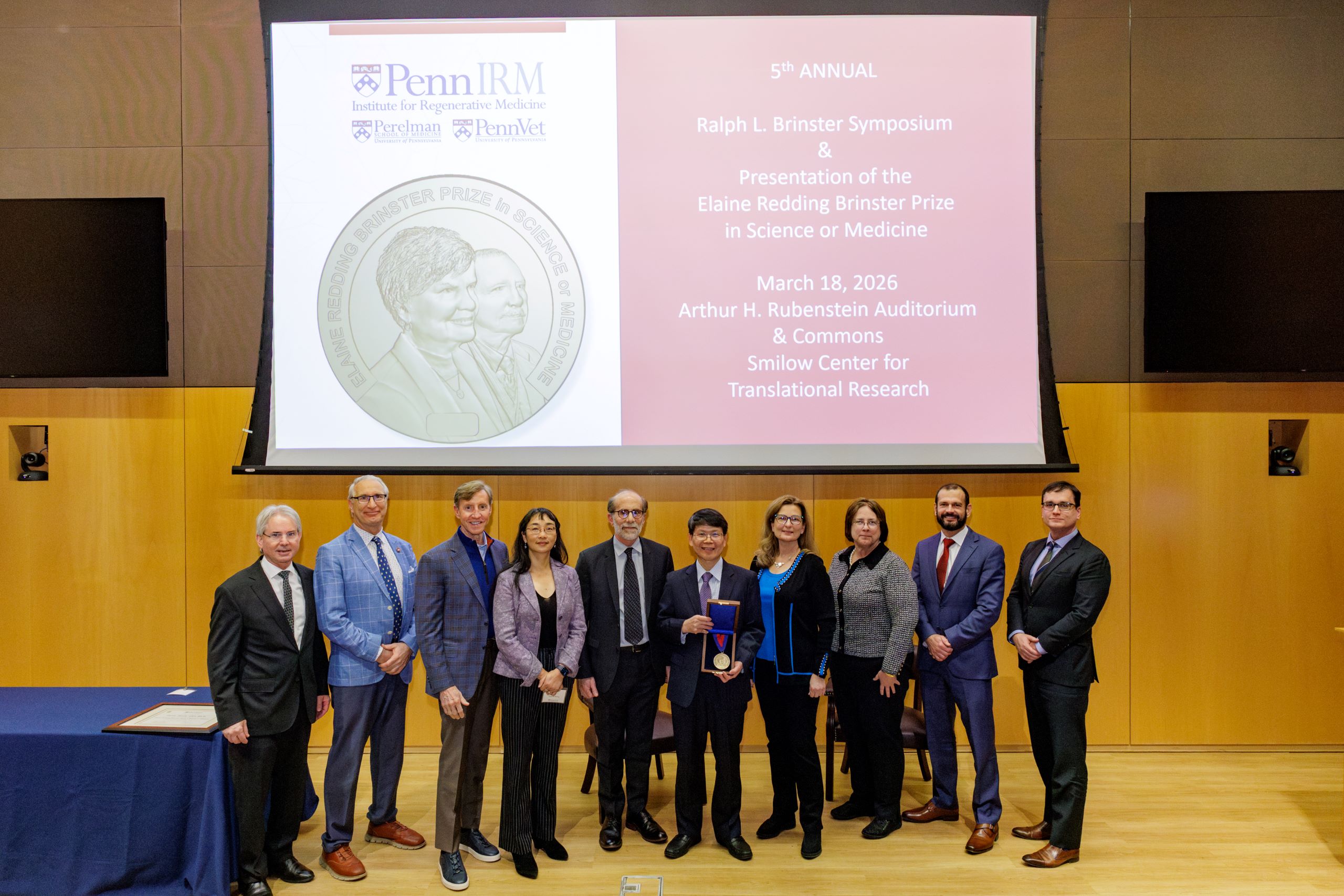 Dr. Zhijian "James" Chen, 2026 Elaine Redding Brinster Prizewinner photographed alongside the children of Ralph & Elaine Brinster, Dr. Ken Zaret (IRM Director), Dr. Guo-li Ming (IRM Associate Director), President Jameson, Dean Hoffman (Penn Vet), and Dean Epstein (PSOM).
